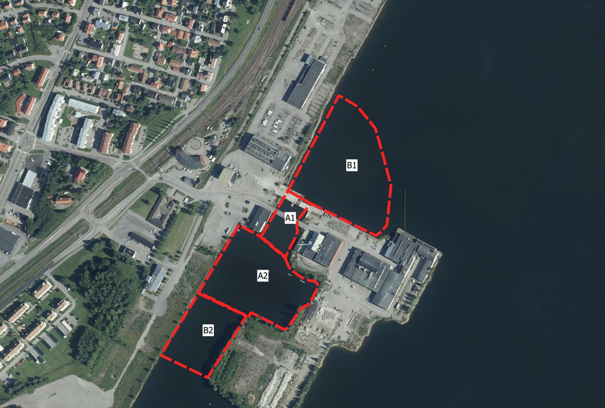 Flygfoto över Håstaholmen. Röda streckade linjer visar de olika arbetsområdena under projektet. 